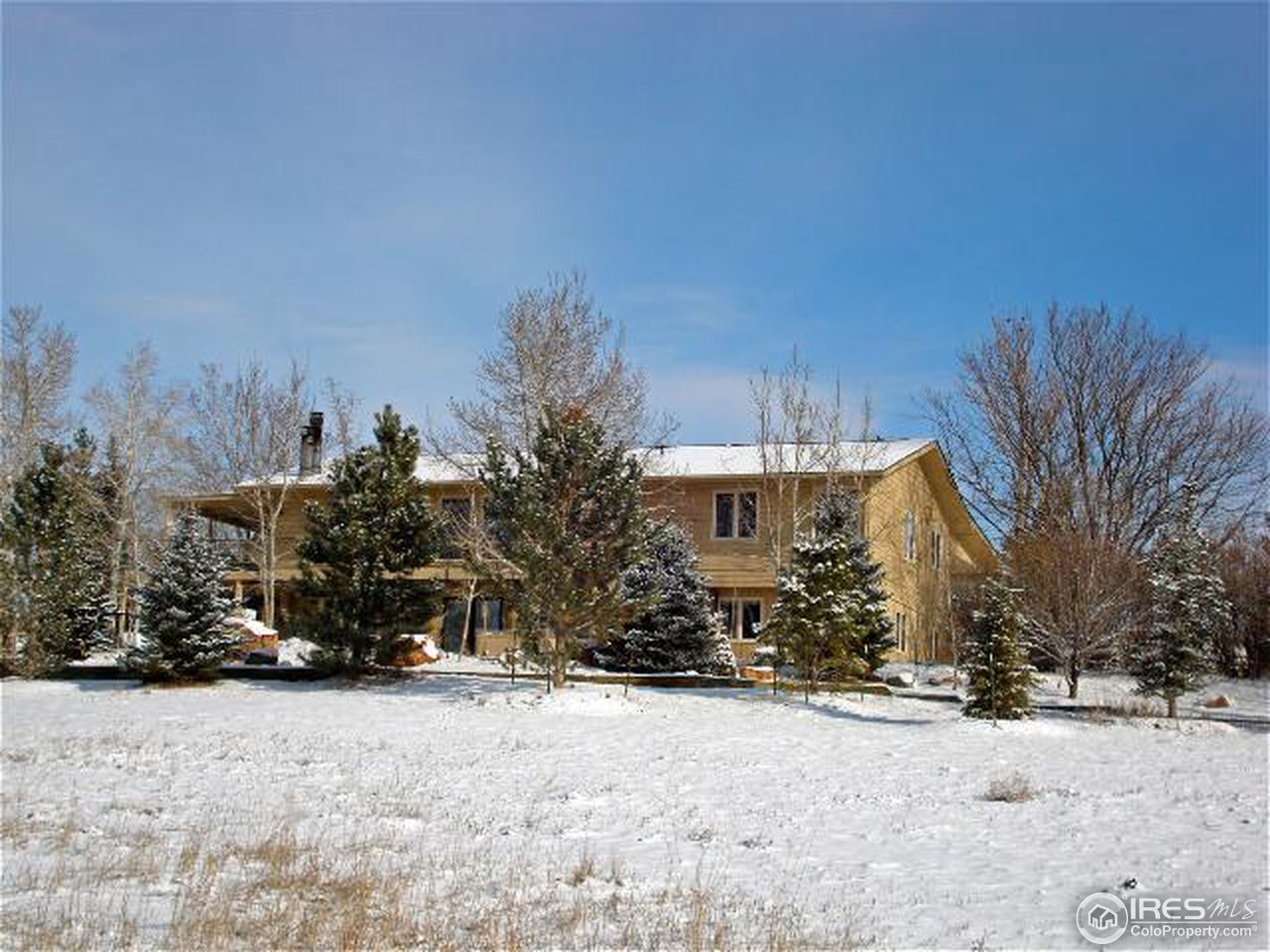 10000 Phillips Road Lafayette, CO 80026 - Photo 1 of 17 a view of a house with a snow in the yard
