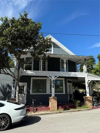 a front view of a house with parking space