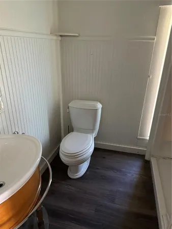 a bathroom with a toilet and a sink