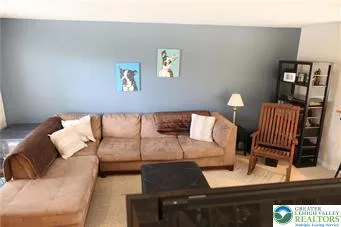 a living room with furniture and window