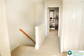 a view of a hallway with seating area