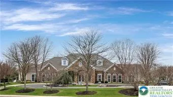 a large building with trees in front of it