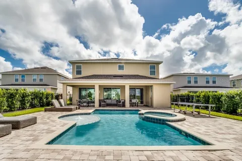 a view of house with yard in front of it