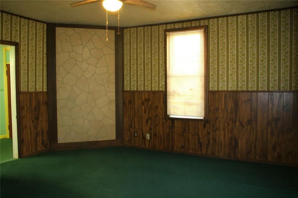 324 West North Street Butler, PA 16001 - Photo 11 of 42 a view of an empty room with a window and chandelier fan