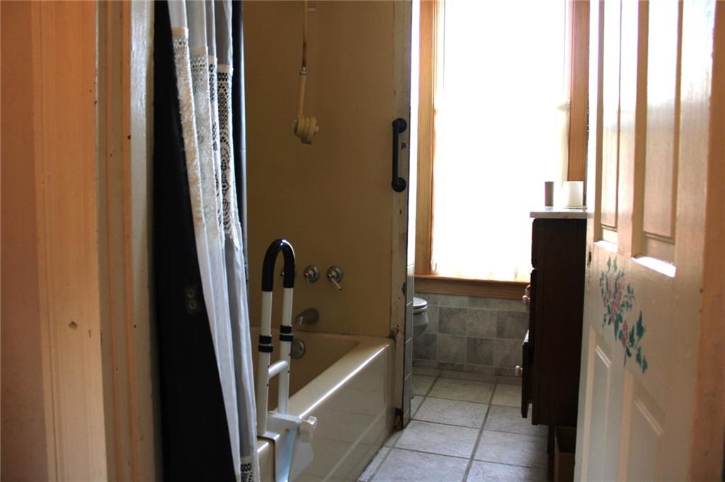 324 West North Street Butler, PA 16001 - Photo 20 of 42 a bathroom with a tub and shower