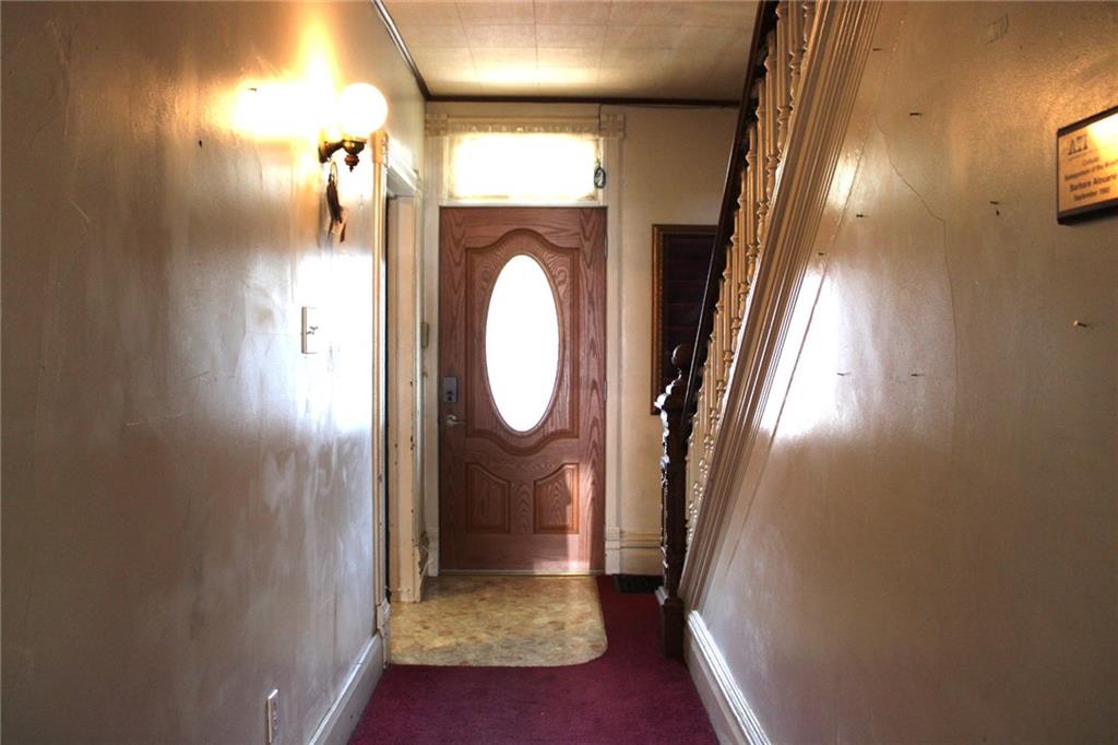 324 West North Street Butler, PA 16001 - Photo 3 of 42 a view of a hallway with washer and dryer