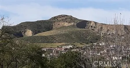 a sign that is sitting on a rock