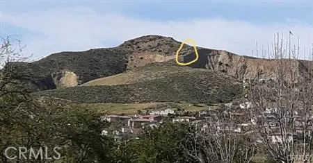 a sign that is sitting on a rock