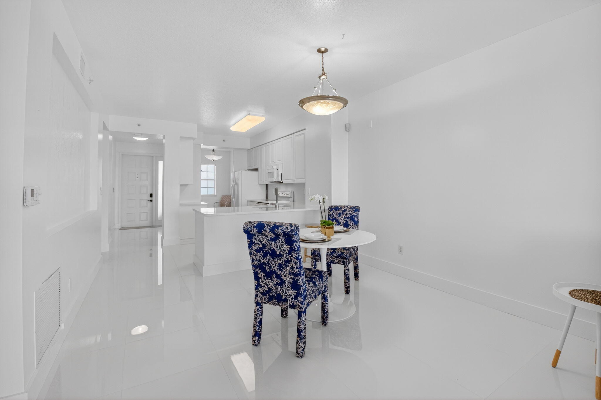 22703 Camino Del Mar, Unit 63 Boca Raton, FL 33433 - Photo 15 of 40 a view of a dining room with furniture