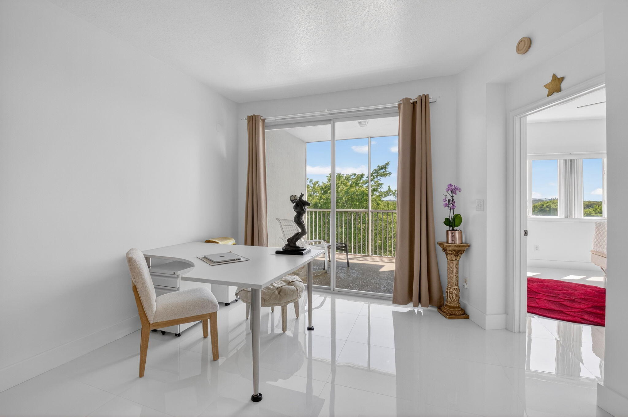 22703 Camino Del Mar, Unit 63 Boca Raton, FL 33433 - Photo 19 of 40 a view of a dining room with furniture and a potted plant