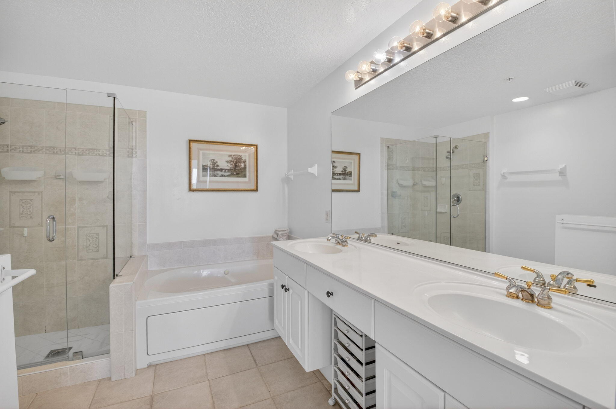 22703 Camino Del Mar, Unit 63 Boca Raton, FL 33433 - Photo 27 of 40 a bath room with a sink vanity tub and shower