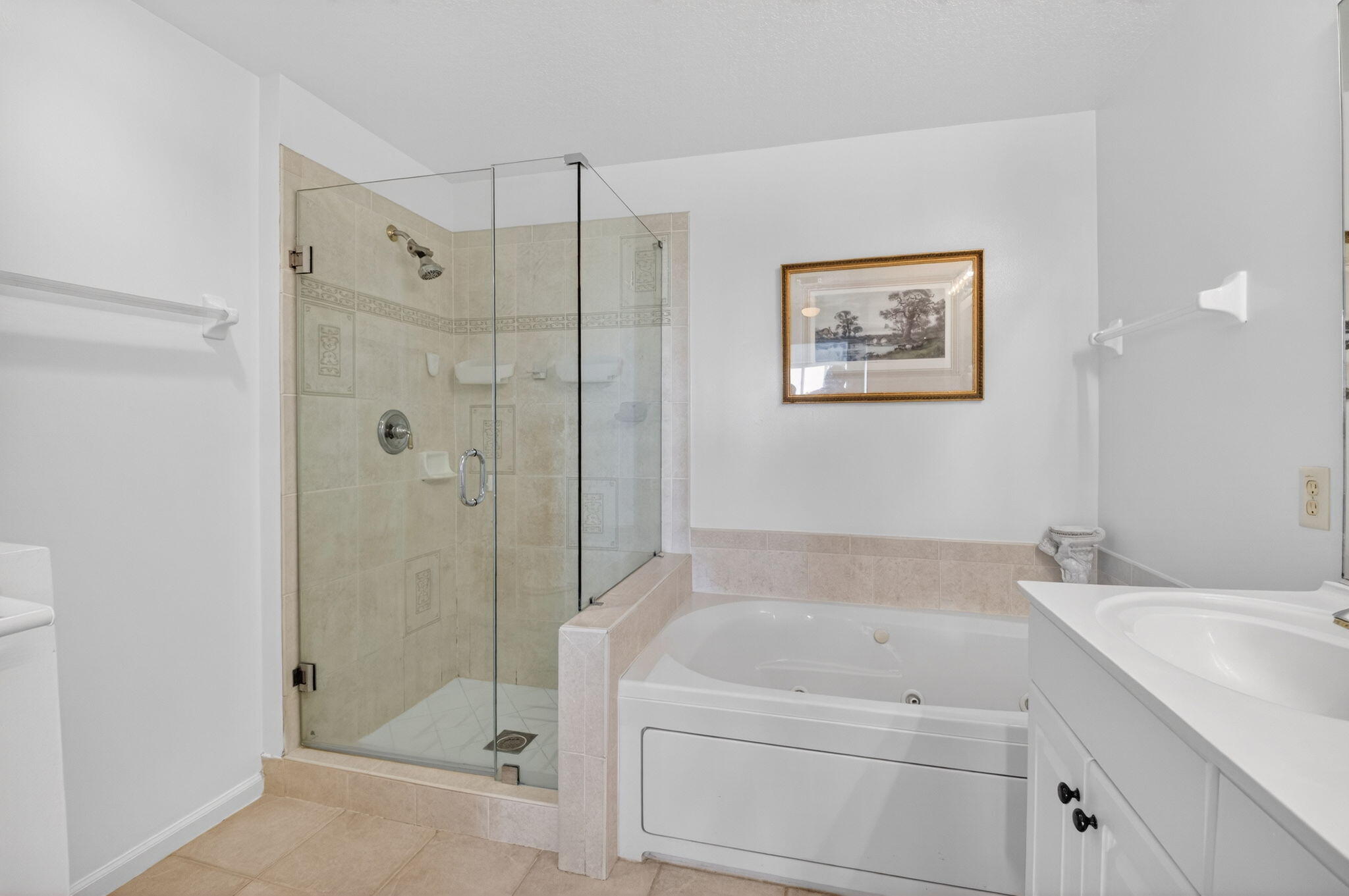 22703 Camino Del Mar, Unit 63 Boca Raton, FL 33433 - Photo 28 of 40 a bathroom with a tub shower sink and mirror