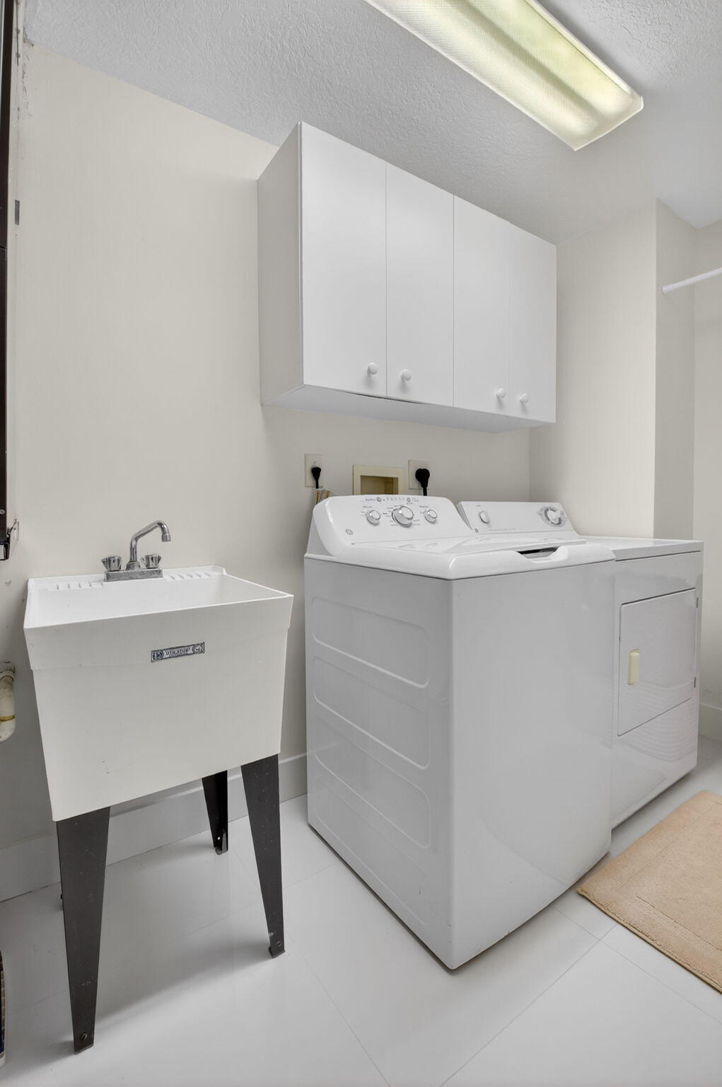 22703 Camino Del Mar, Unit 63 Boca Raton, FL 33433 - Photo 29 of 40 a bathroom with a sink vanity and a mirror