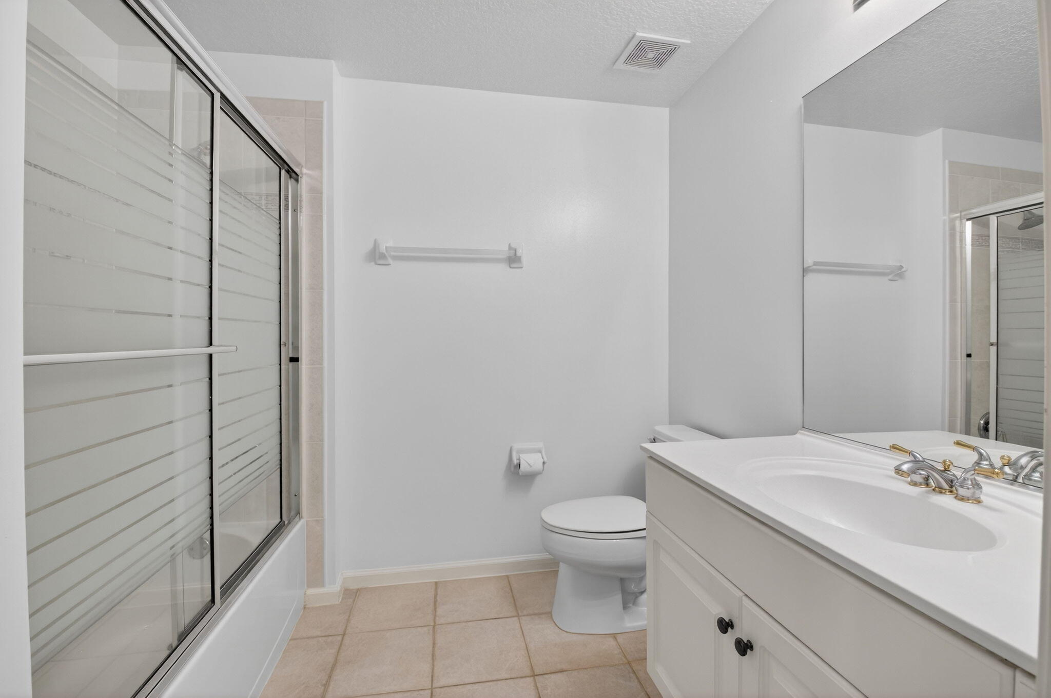 22703 Camino Del Mar, Unit 63 Boca Raton, FL 33433 - Photo 32 of 40 a bathroom with a granite countertop sink toilet and shower