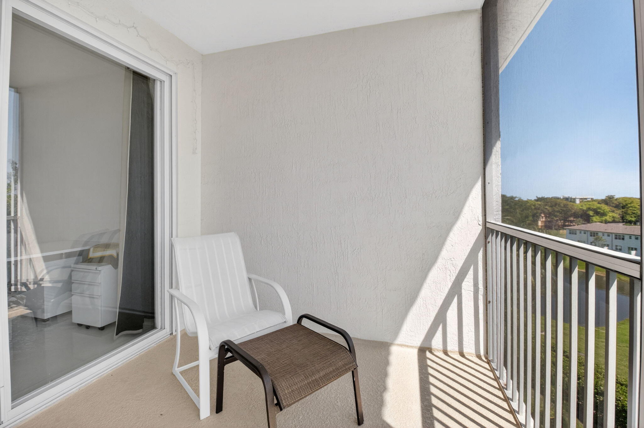 22703 Camino Del Mar, Unit 63 Boca Raton, FL 33433 - Photo 34 of 40 a view of a hallway with furniture and front door