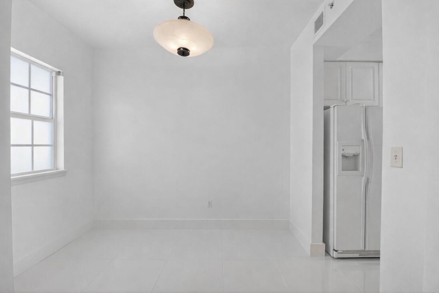 22703 Camino Del Mar, Unit 63 Boca Raton, FL 33433 - Photo 6 of 40 an empty room with windows and closet