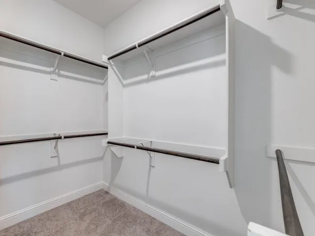 a view of an empty walk in closet