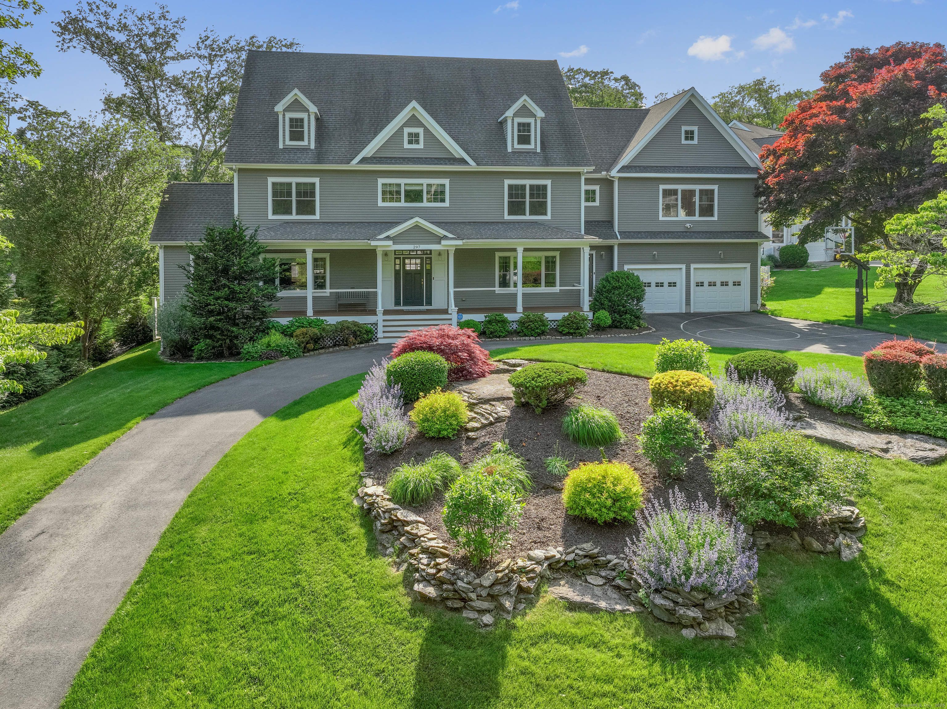 297 Romanock Road Fairfield, CT 06825 - Photo 1 of 1 a front view of house with yard and green space