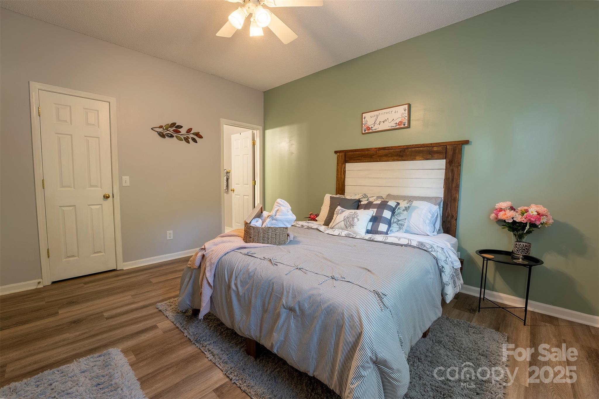 3412 Summerfield Ridge Lane Matthews, NC 28105 - Photo 14 of 30 a bedroom with a bed and a chandelier