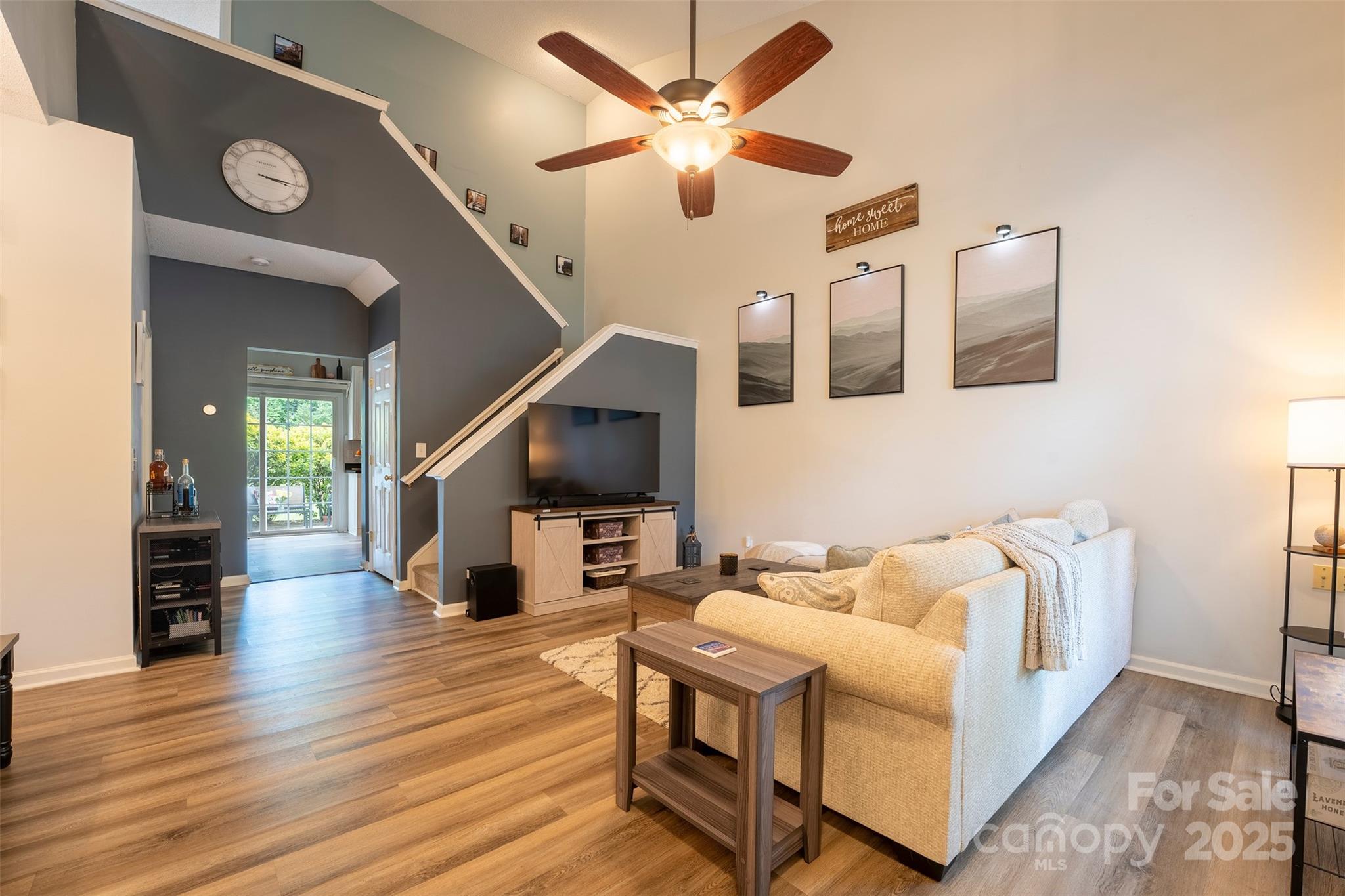 3412 Summerfield Ridge Lane Matthews, NC 28105 - Photo 2 of 30 a living room with furniture and a flat screen tv