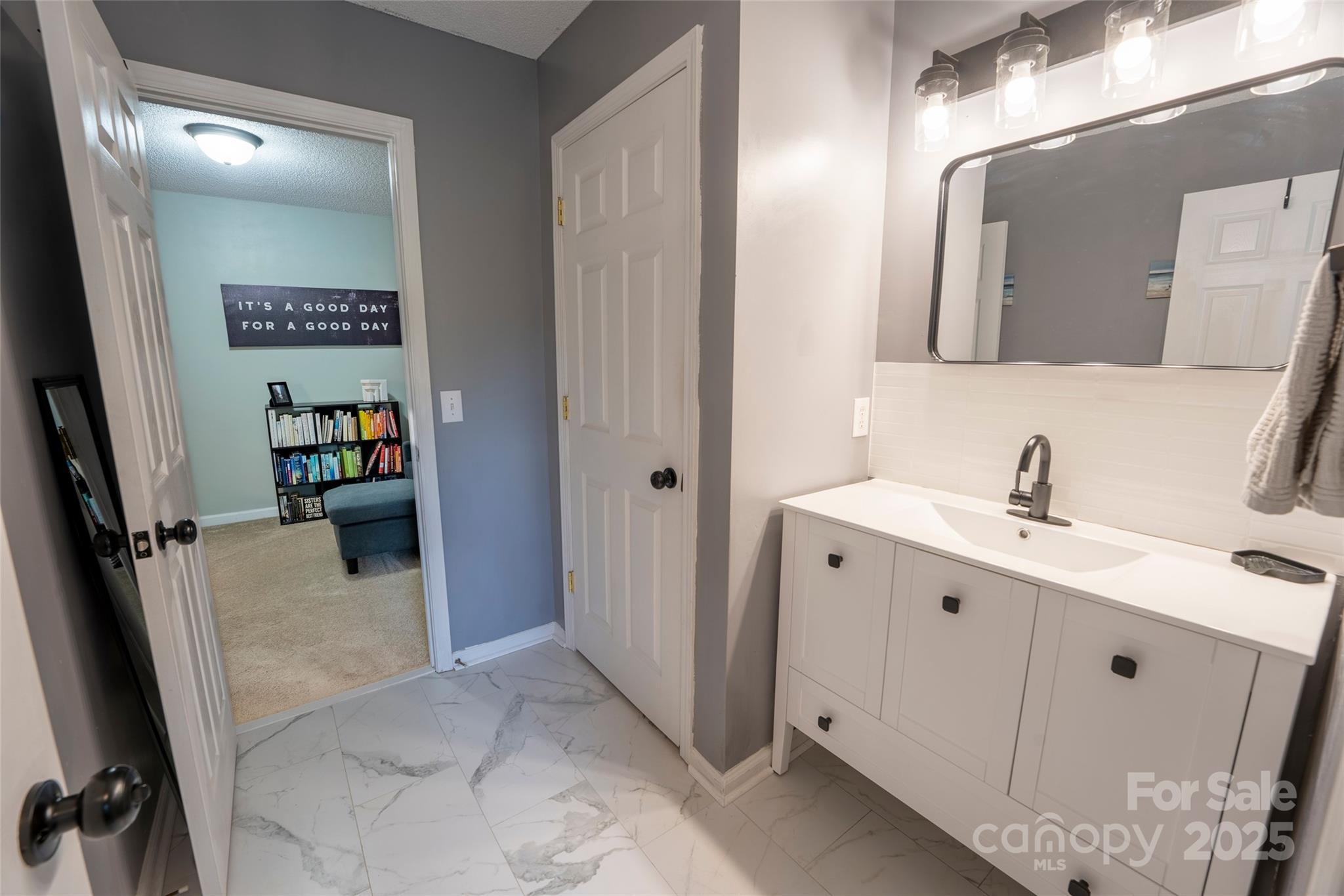 3412 Summerfield Ridge Lane Matthews, NC 28105 - Photo 23 of 30 a bathroom with a double vanity sink and mirror