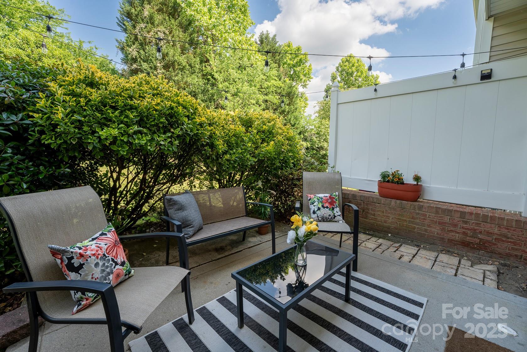 3412 Summerfield Ridge Lane Matthews, NC 28105 - Photo 27 of 30 a roof deck with chairs and potted plants