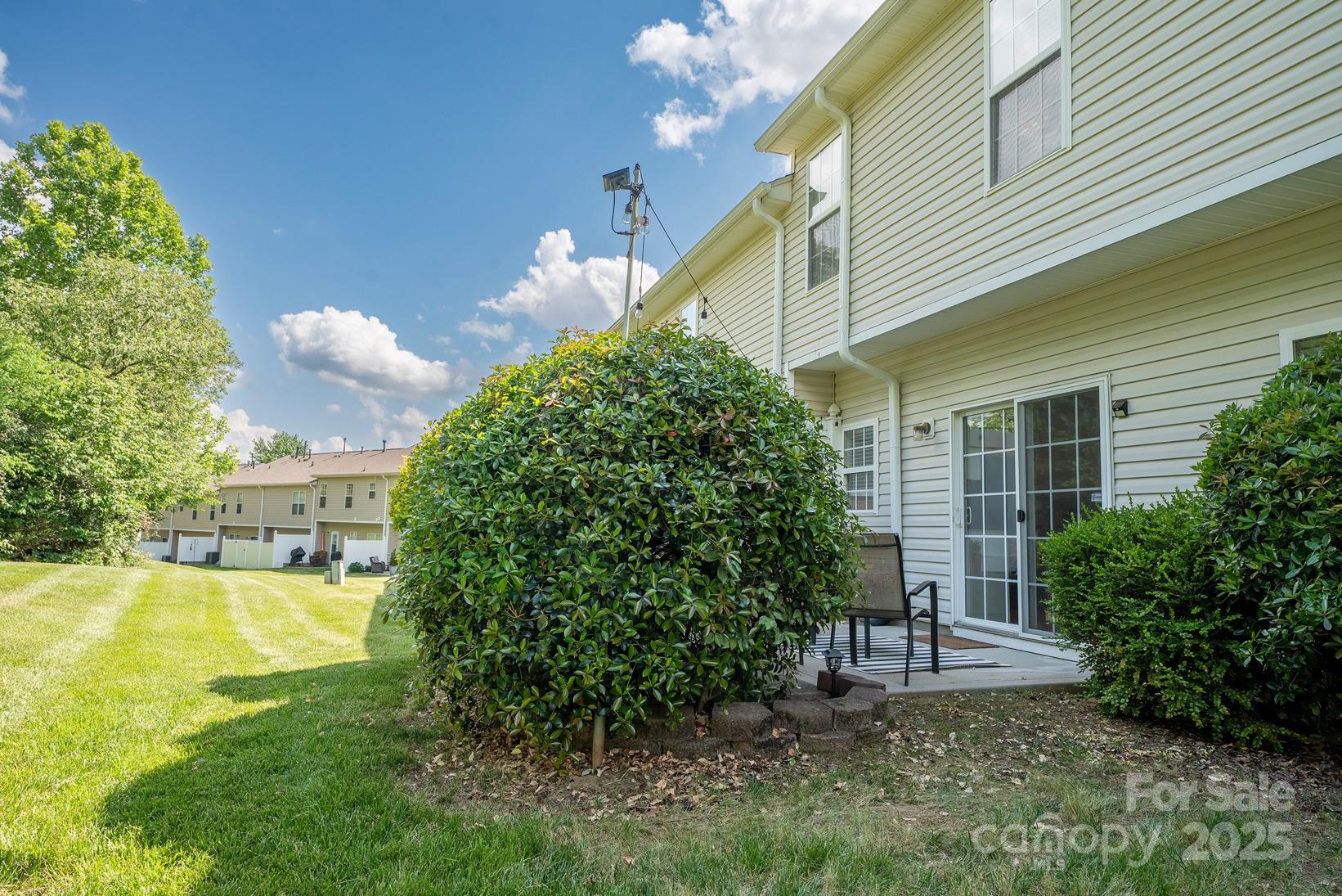 3412 Summerfield Ridge Lane Matthews, NC 28105 - Photo 28 of 30 a view of a house with a yard and sitting area