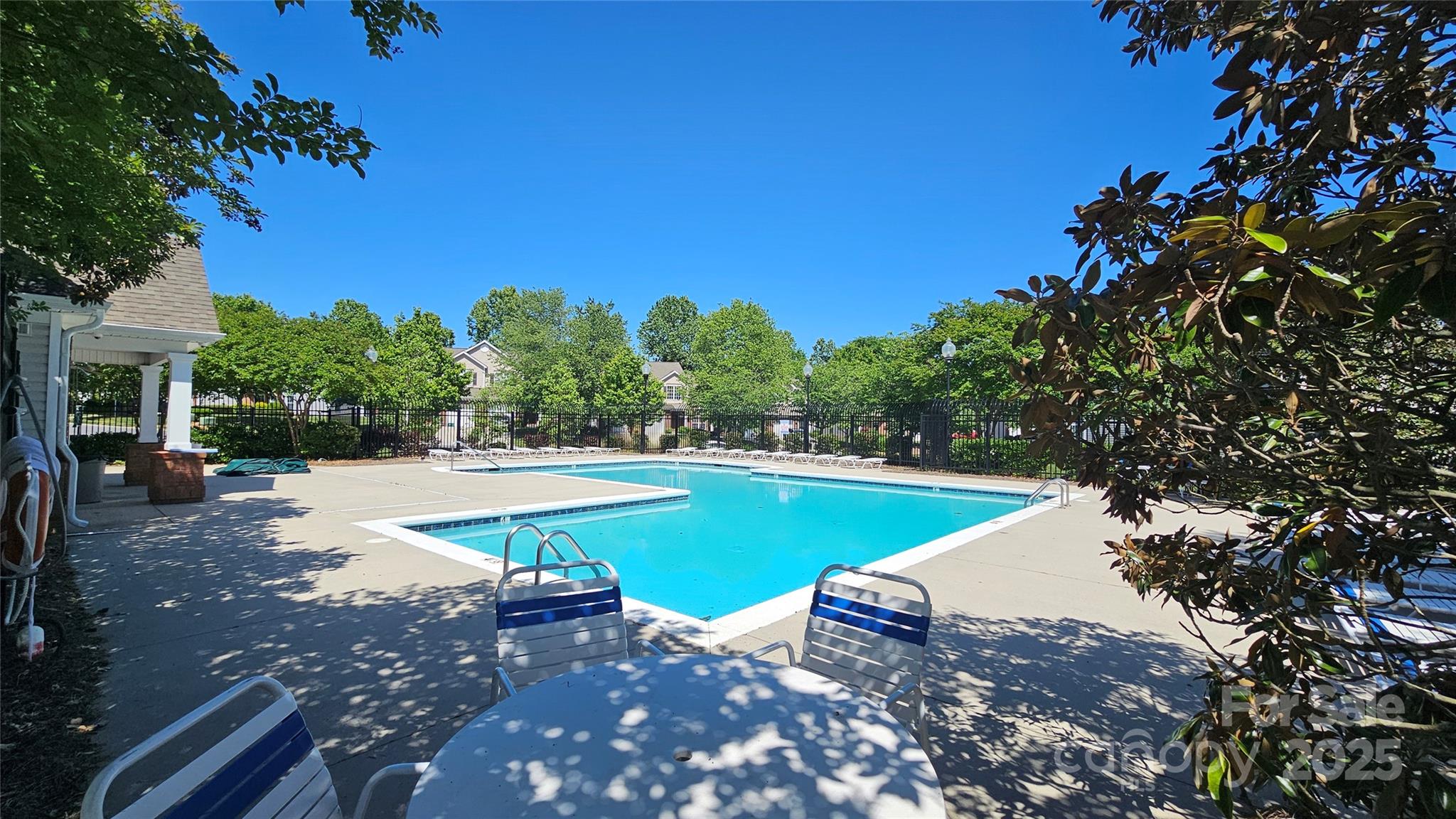 3412 Summerfield Ridge Lane Matthews, NC 28105 - Photo 30 of 30 a view of a swimming pool with an outdoor space and seating area