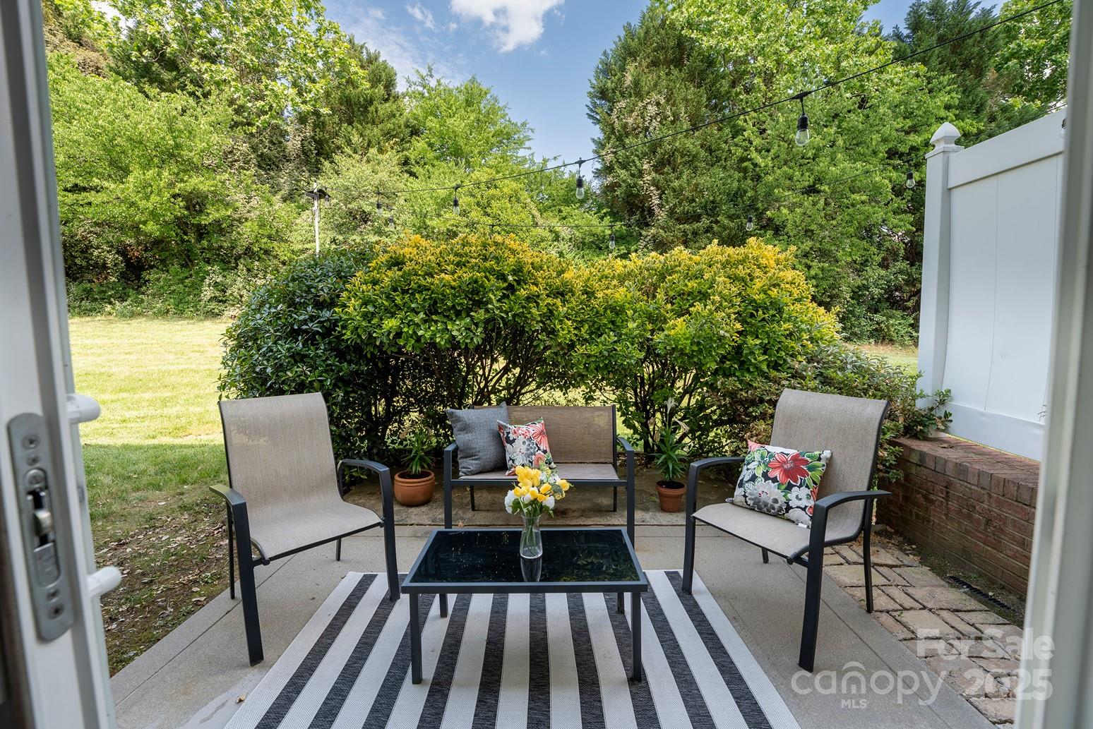 3412 Summerfield Ridge Lane Matthews, NC 28105 - Photo 9 of 30 a view of a patio with couple of chairs and a couch