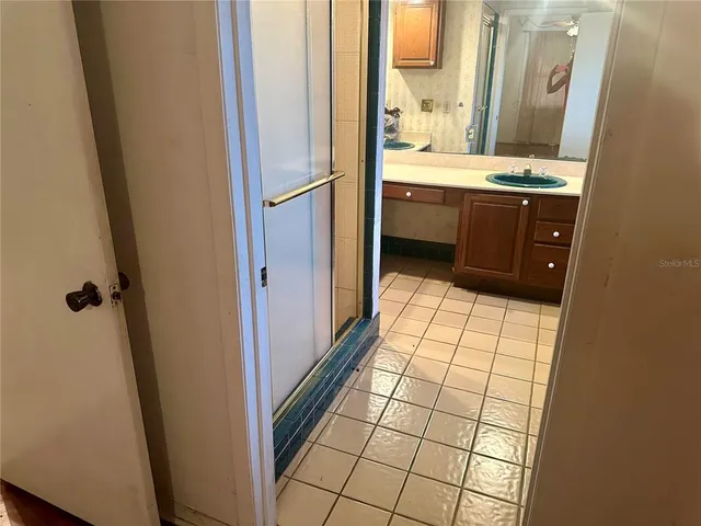 a bathroom with a sink a vanity and a mirror