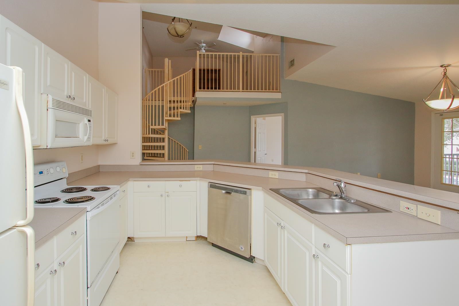 21201 Harbour Vista Circle St. Augustine, FL 32080 - Photo 11 of 43 a kitchen with a sink stove and cabinets