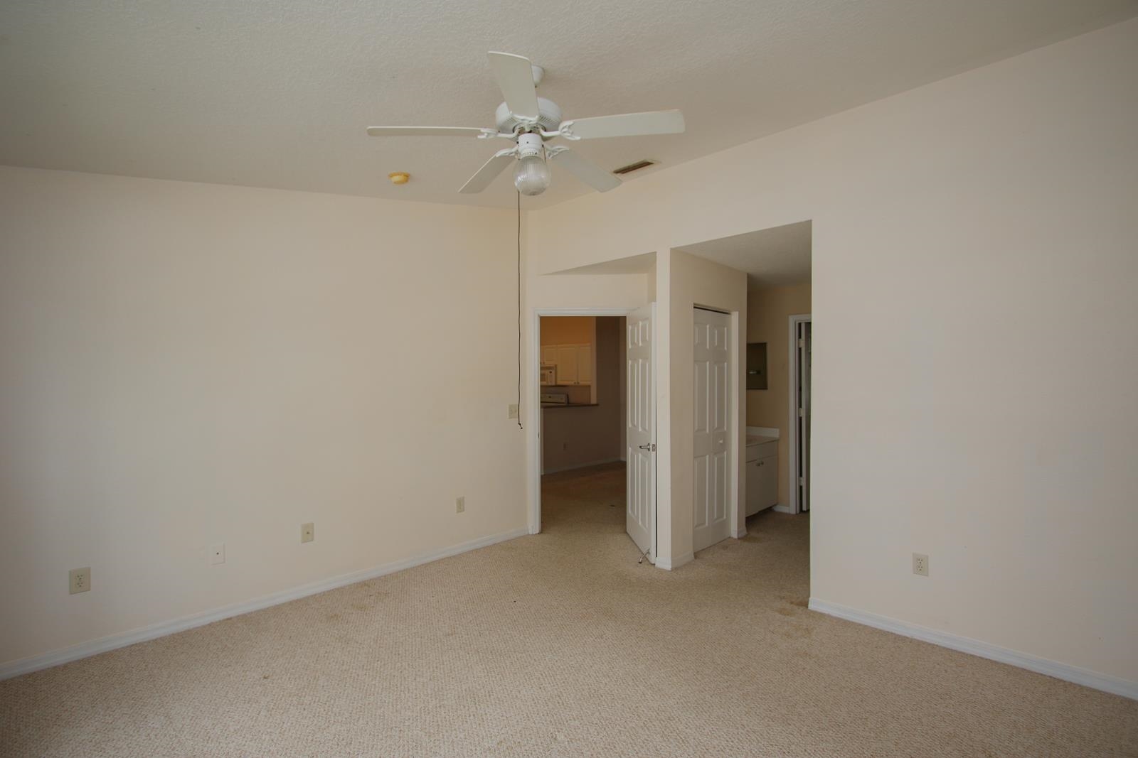 21201 Harbour Vista Circle St. Augustine, FL 32080 - Photo 16 of 43 an empty room with a ceiling fan and bathroom
