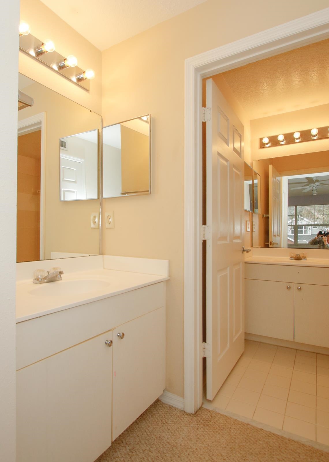 21201 Harbour Vista Circle St. Augustine, FL 32080 - Photo 17 of 43 a bathroom with a sink a toilet and a large mirror