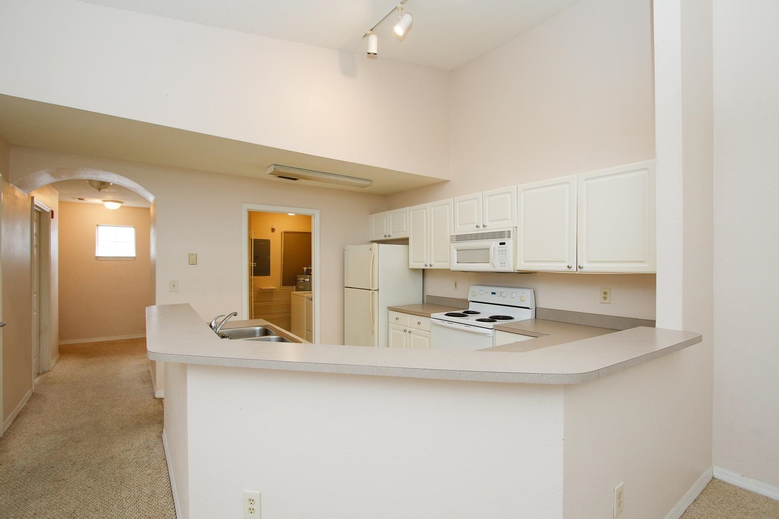 21201 Harbour Vista Circle St. Augustine, FL 32080 - Photo 10 of 43 a kitchen with kitchen island a sink appliances and cabinets
