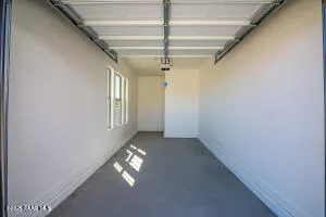 a view of swimming pool with outdoor seating and covered with trees