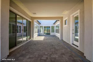 a view of a terrace with couches and city view