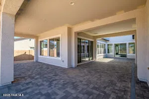 a living room with furniture and a kitchen