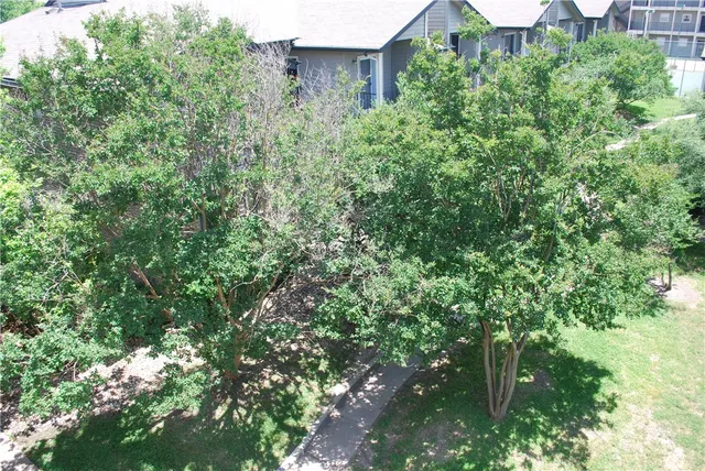 an aerial view of house with yard