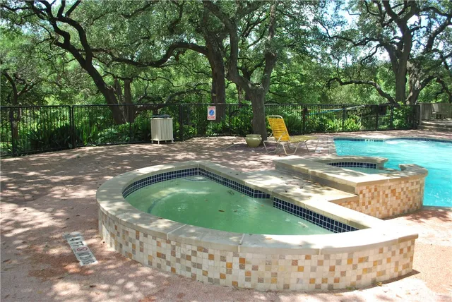 a view of a tree in the middle of a yard