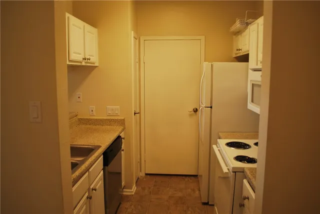 a bathroom with a shower and a sink
