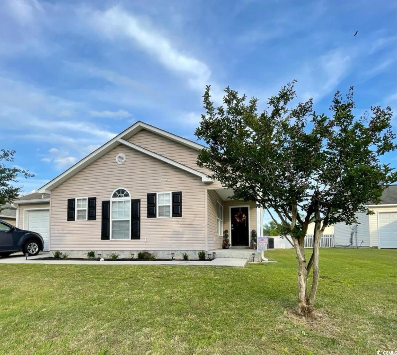 232 Oak Lea Drive Conway, SC 29526 - Photo 1 of 16 View of front facade featuring a front lawn and an attached garage