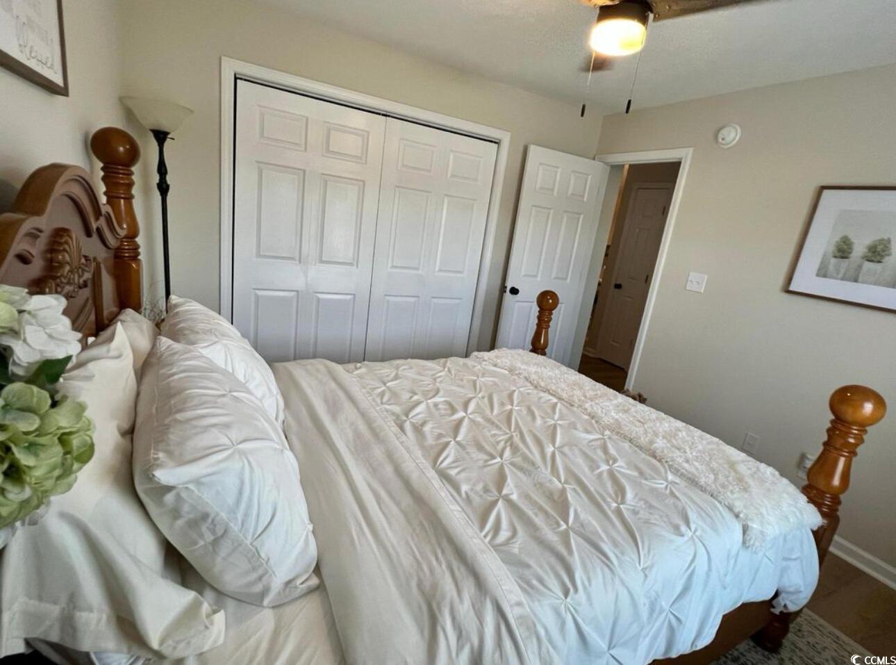 232 Oak Lea Drive Conway, SC 29526 - Photo 12 of 16 Bedroom featuring ceiling fan, a closet, and wood finished floors
