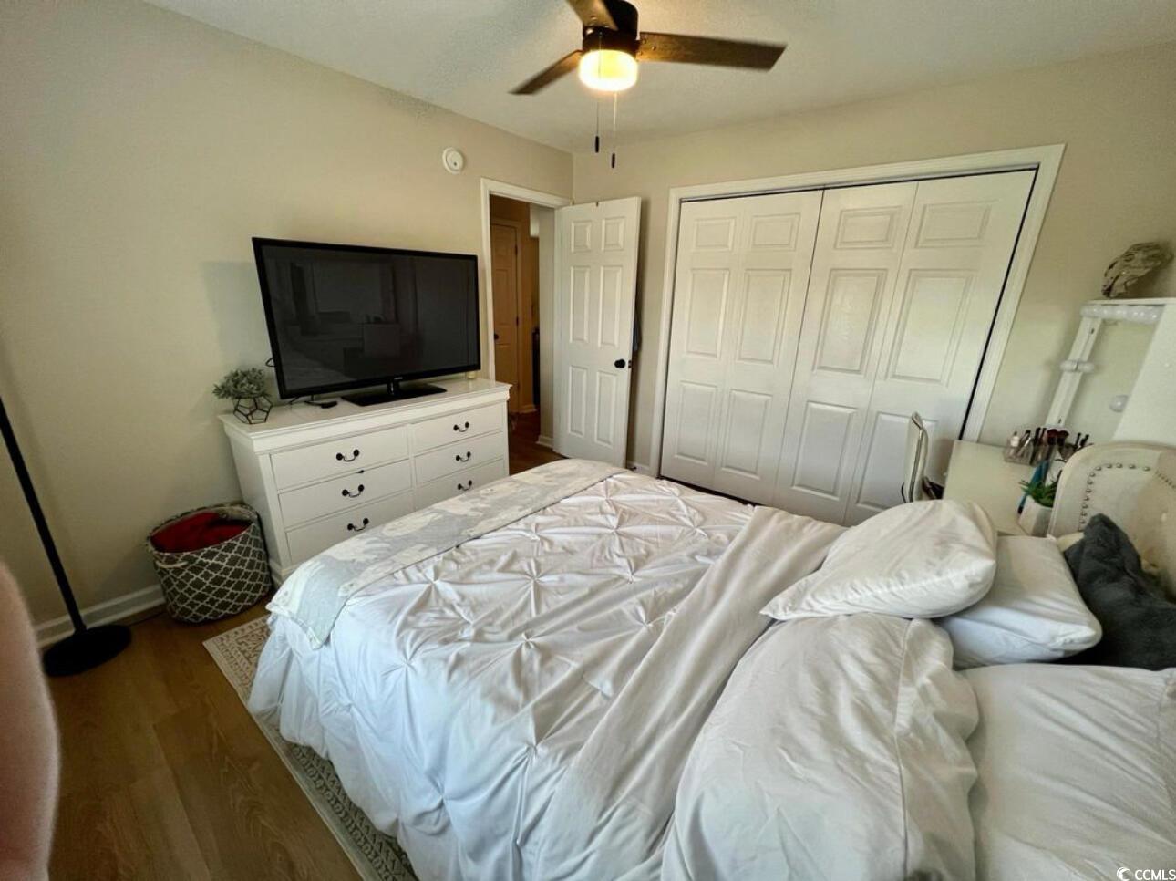 232 Oak Lea Drive Conway, SC 29526 - Photo 13 of 16 Bedroom featuring wood finished floors, a closet, and a ceiling fan
