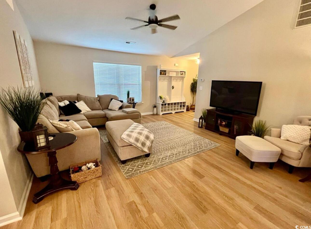 232 Oak Lea Drive Conway, SC 29526 - Photo 4 of 16 Living room with vaulted ceiling, light wood-style floors, and a ceiling fan