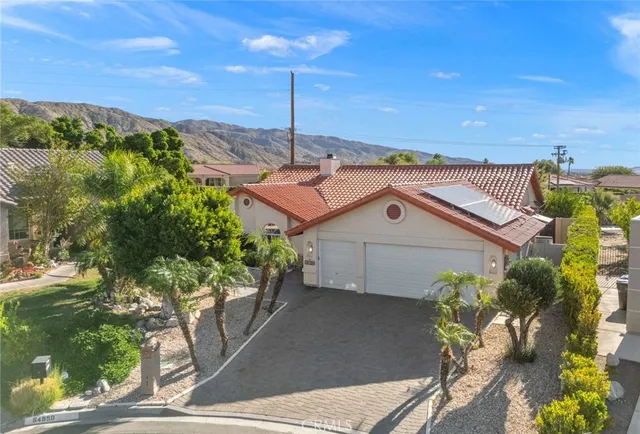 a view of a house with a street