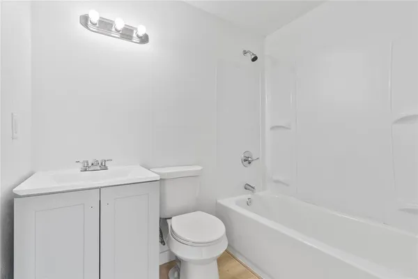 a bathroom with a sink toilet and bathtub