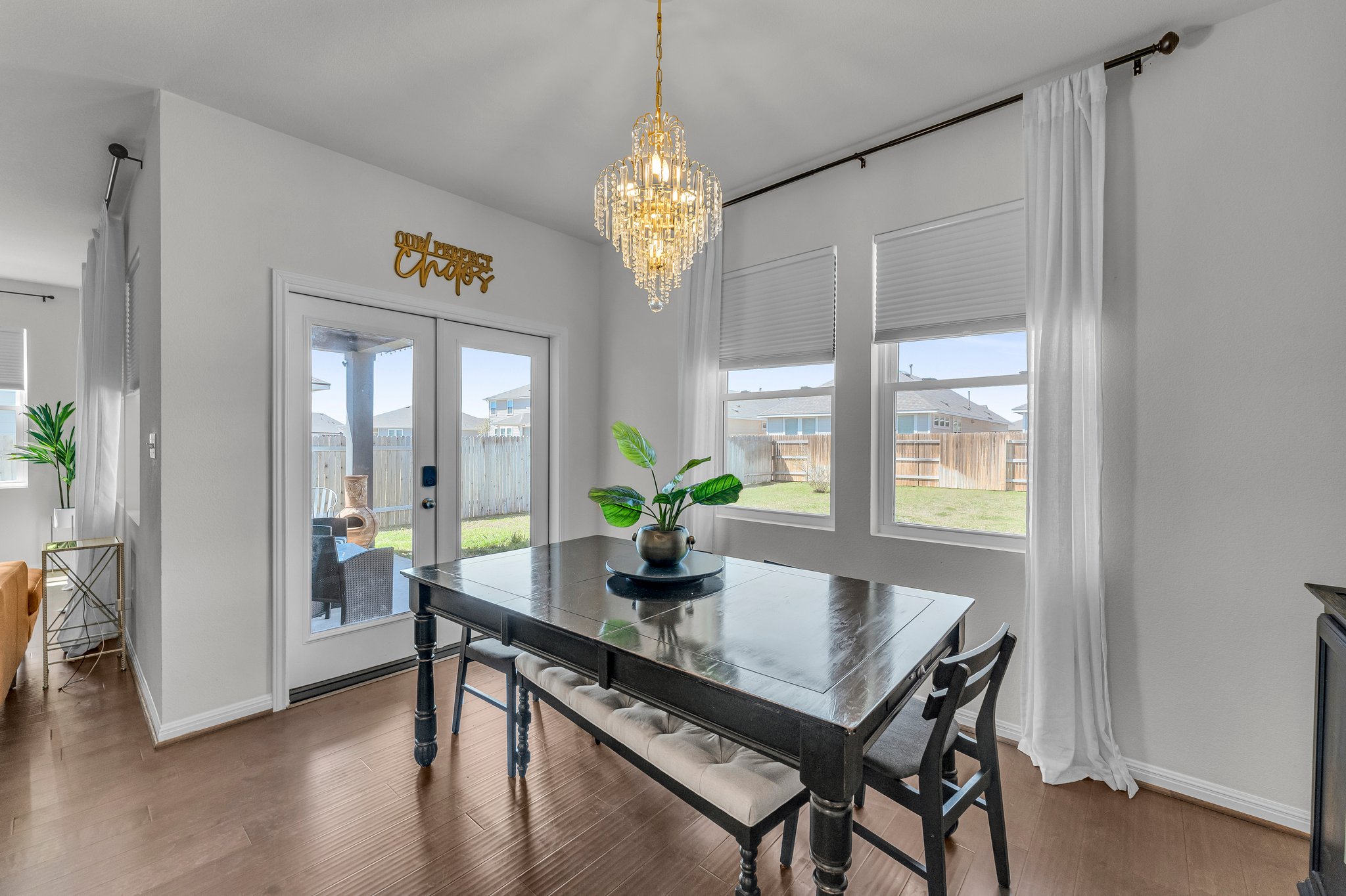 306 Cold Spg Loop Bastrop, TX 78602 - Photo 11 of 25 Dining area with a wealth of natural light, french doors, baseboards, and wood finished floors