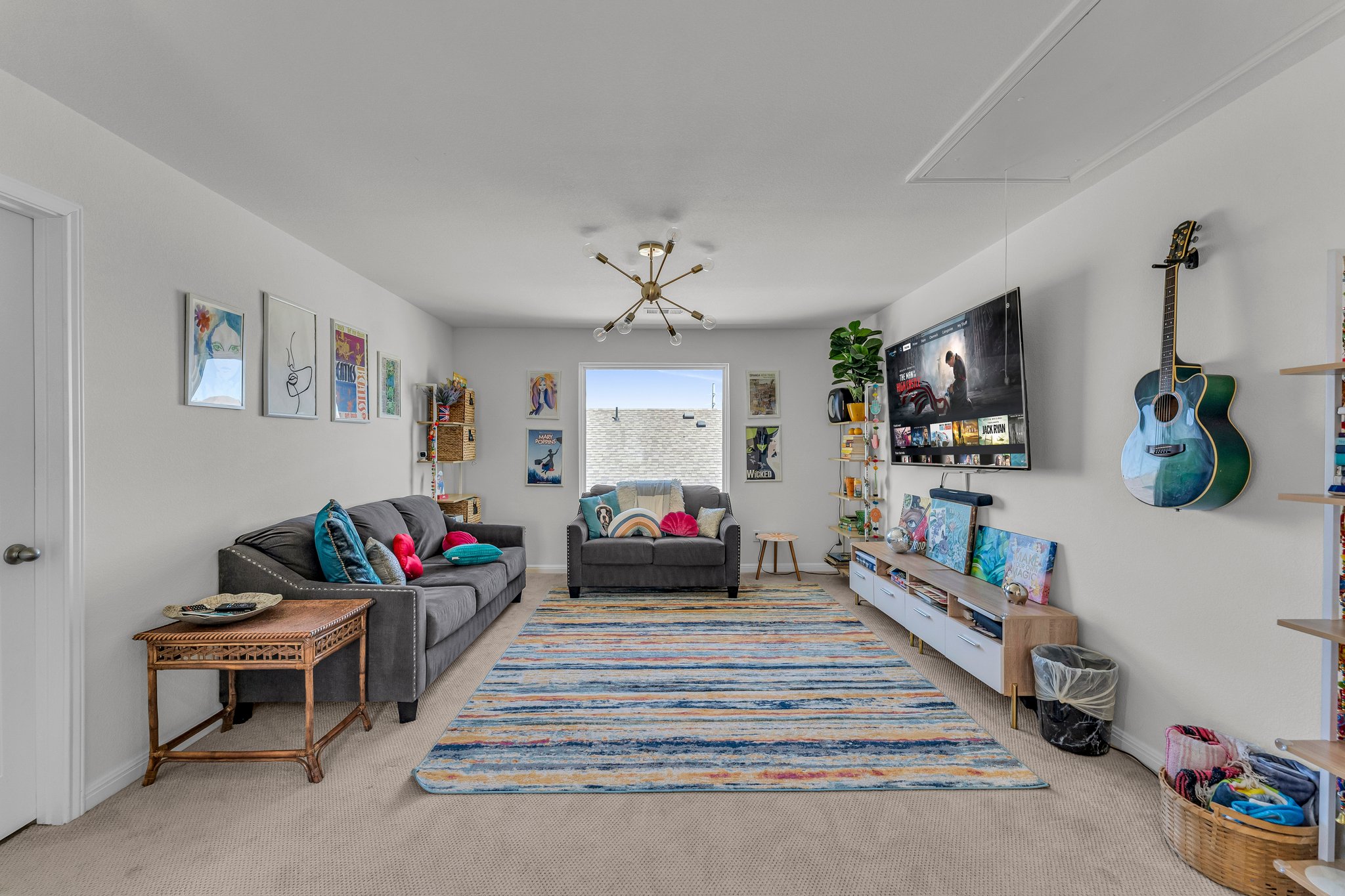 306 Cold Spg Loop Bastrop, TX 78602 - Photo 16 of 25 Carpeted living room featuring baseboards and attic access