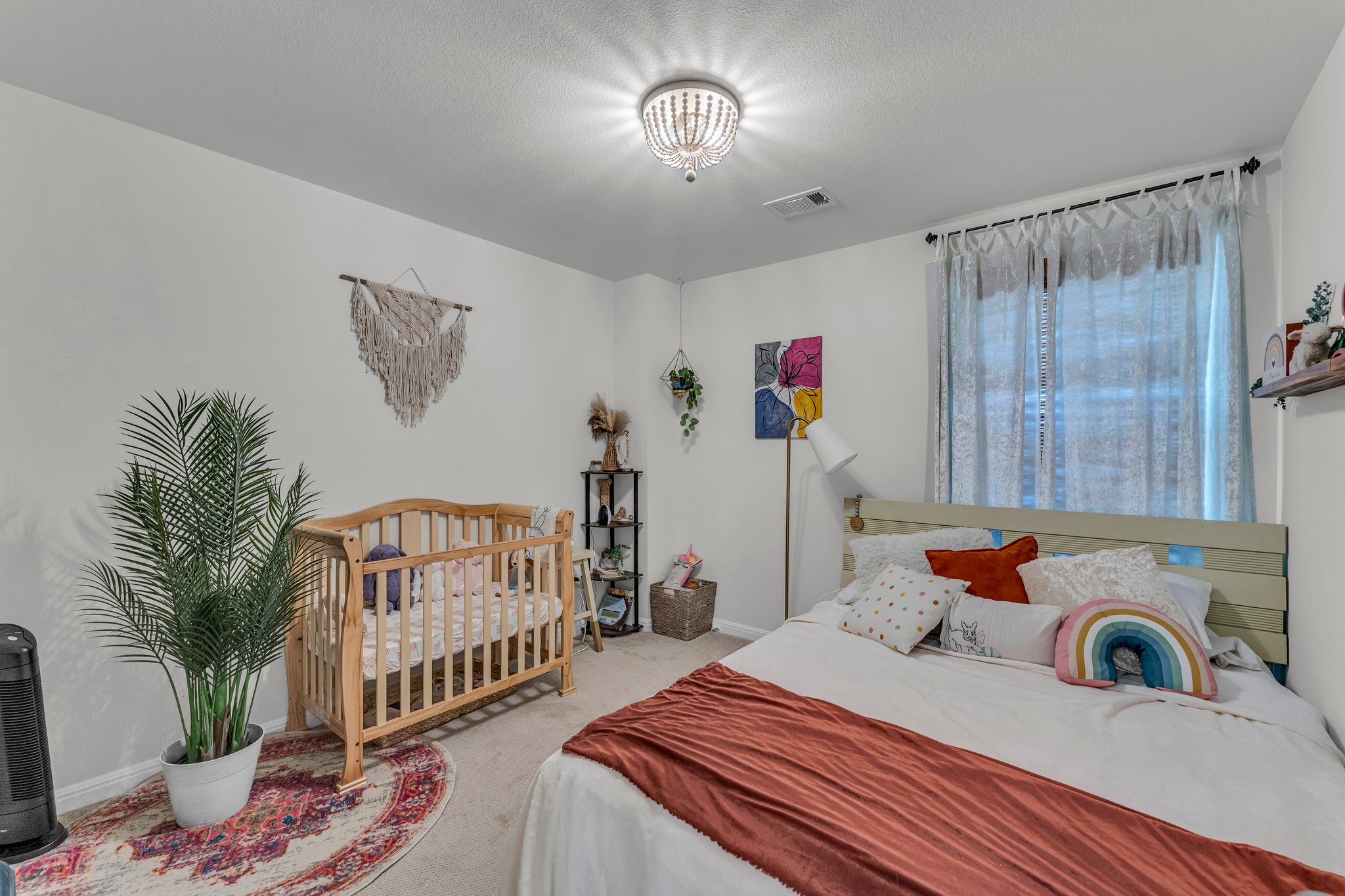 306 Cold Spg Loop Bastrop, TX 78602 - Photo 17 of 25 Bedroom featuring baseboards, visible vents, and carpet floors