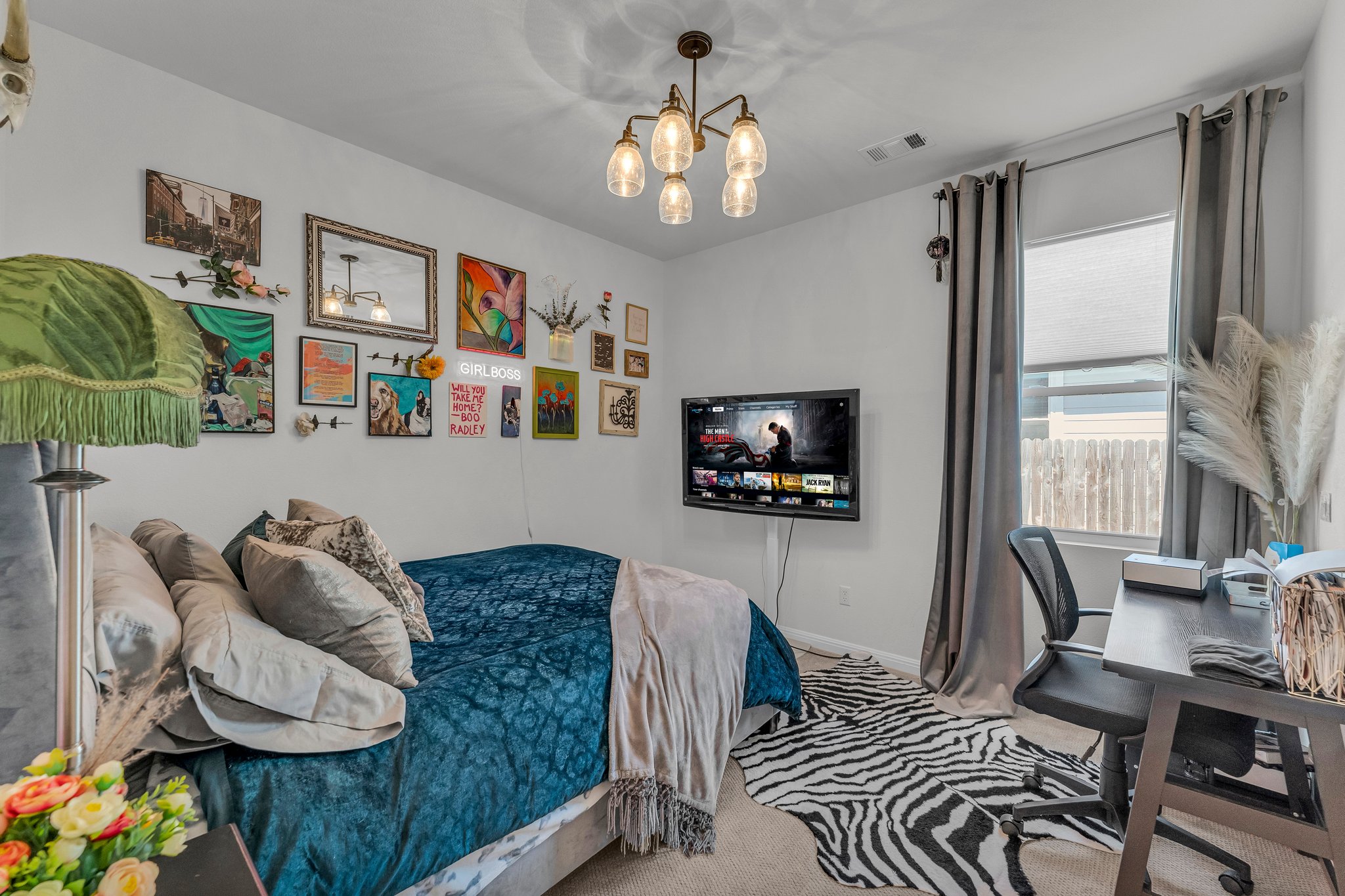306 Cold Spg Loop Bastrop, TX 78602 - Photo 19 of 25 Carpeted bedroom featuring visible vents, baseboards, and a notable chandelier